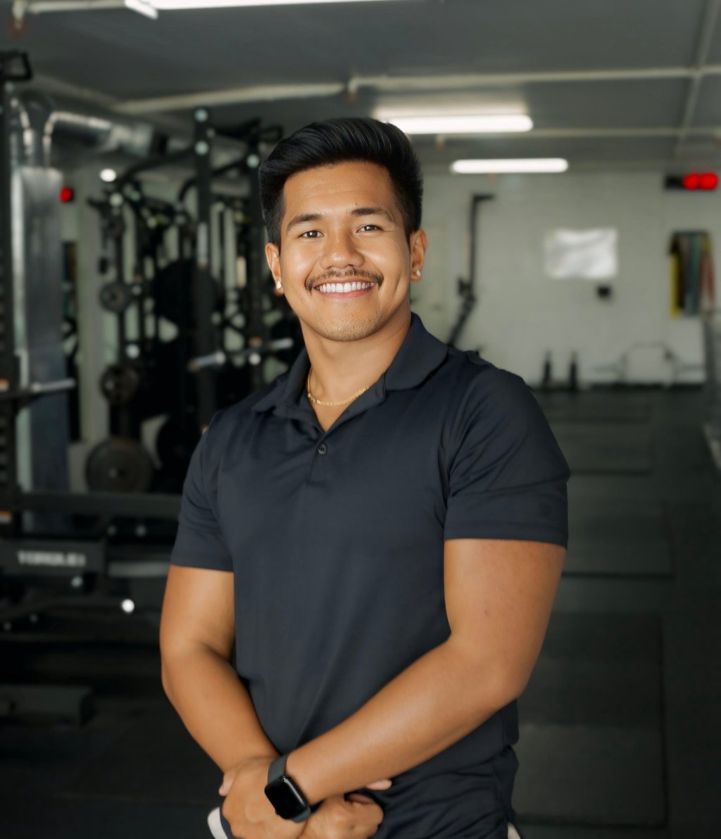 Archie Barrina smiling in his training space